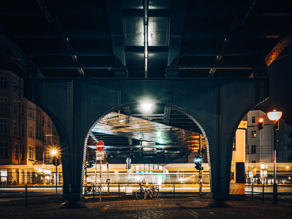 Blurred tram under the underground line at Eberswalder Straße station
