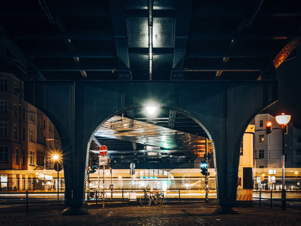 Blurred tram under the underground line at Eberswalder Straße station