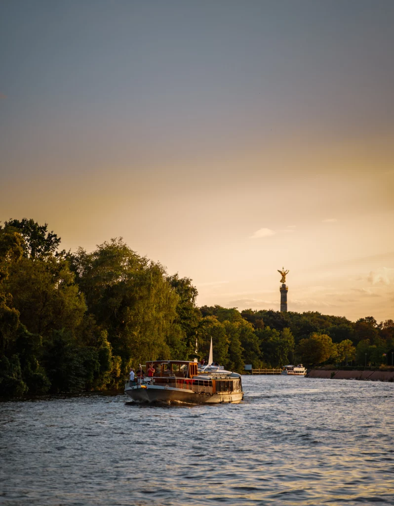 Old excursion steamer on the Spree with the Victory Column in the background